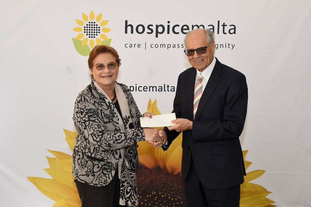 Governor Scicluna presenting a donation to Ms Bernadette Bonnici Kind Governor Scicluna presenting a donation to Ms Bernadette Bonnici Kind